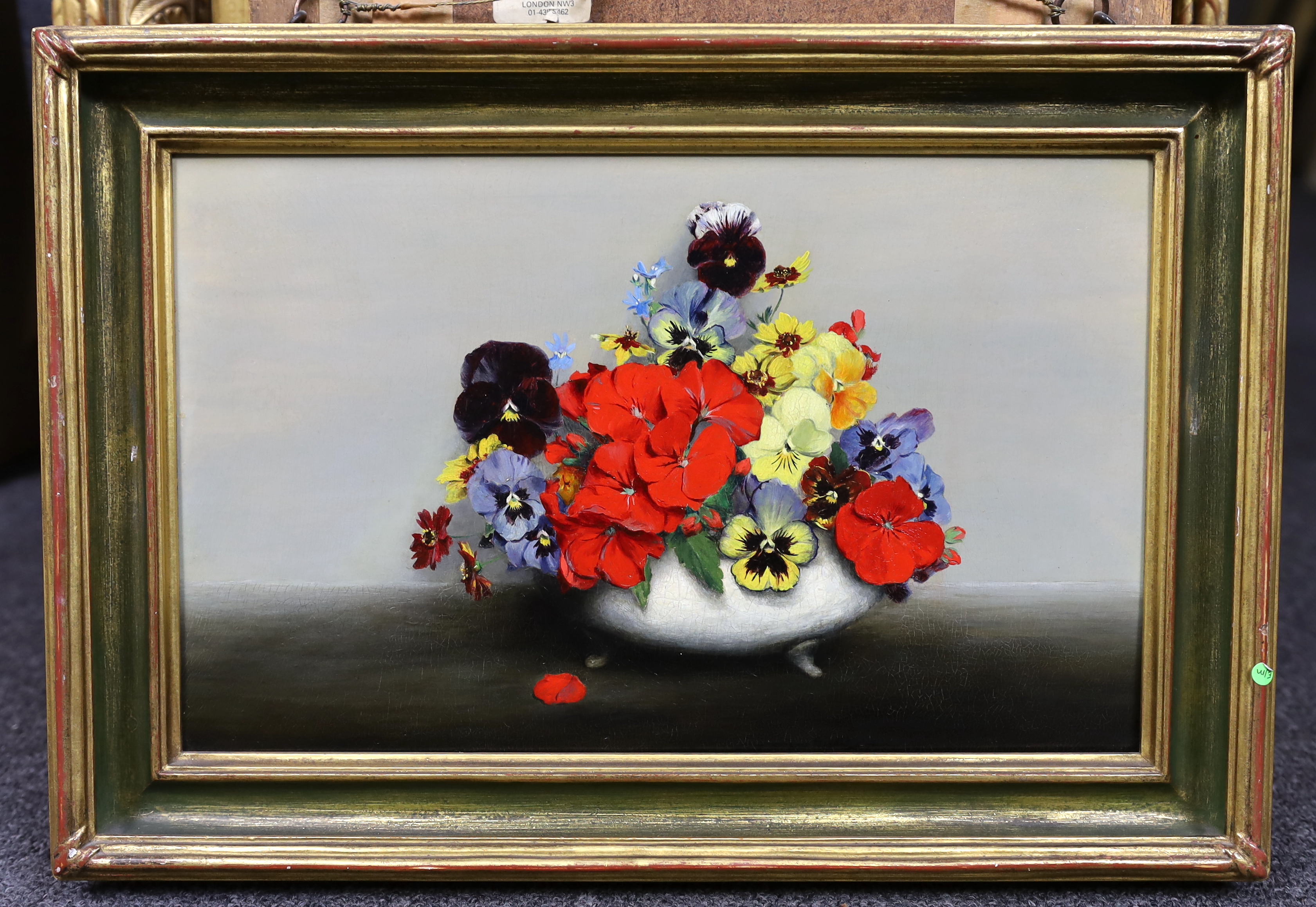 Laurence Biddle (English, 1888-1968), ‘’Geranium’s, pansies, nemesia and coleopsis’, trompe l’oeil style, oil on panel, 21.5 x 34cm, Please note this lot attracts an additional import tax of 5% on the hammer price